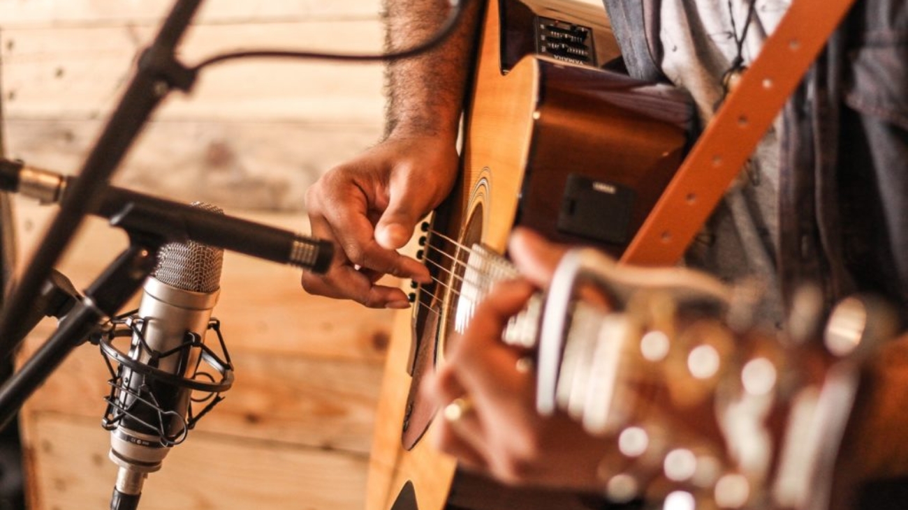 person-playing-acoustic-guitar-2291538-1024x682